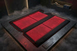 RECON Lumi Mat laid open with red LEDs glowing on a dark misty platform
