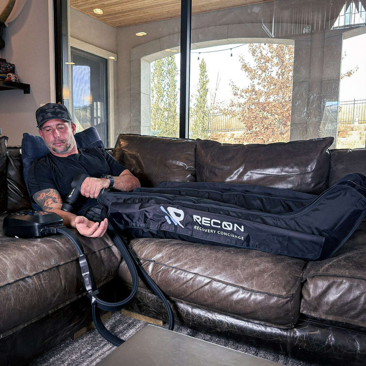 RECON Elite Compression System in use on a leather couch
