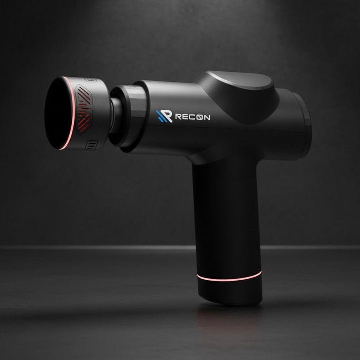 Black massage gun with 'RECON' branding on a dark background