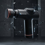 Black recon wellness massage gun with red accents on a dark background