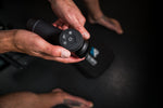 Close-up of the RECON Pulse Massage Gun control buttons and battery display